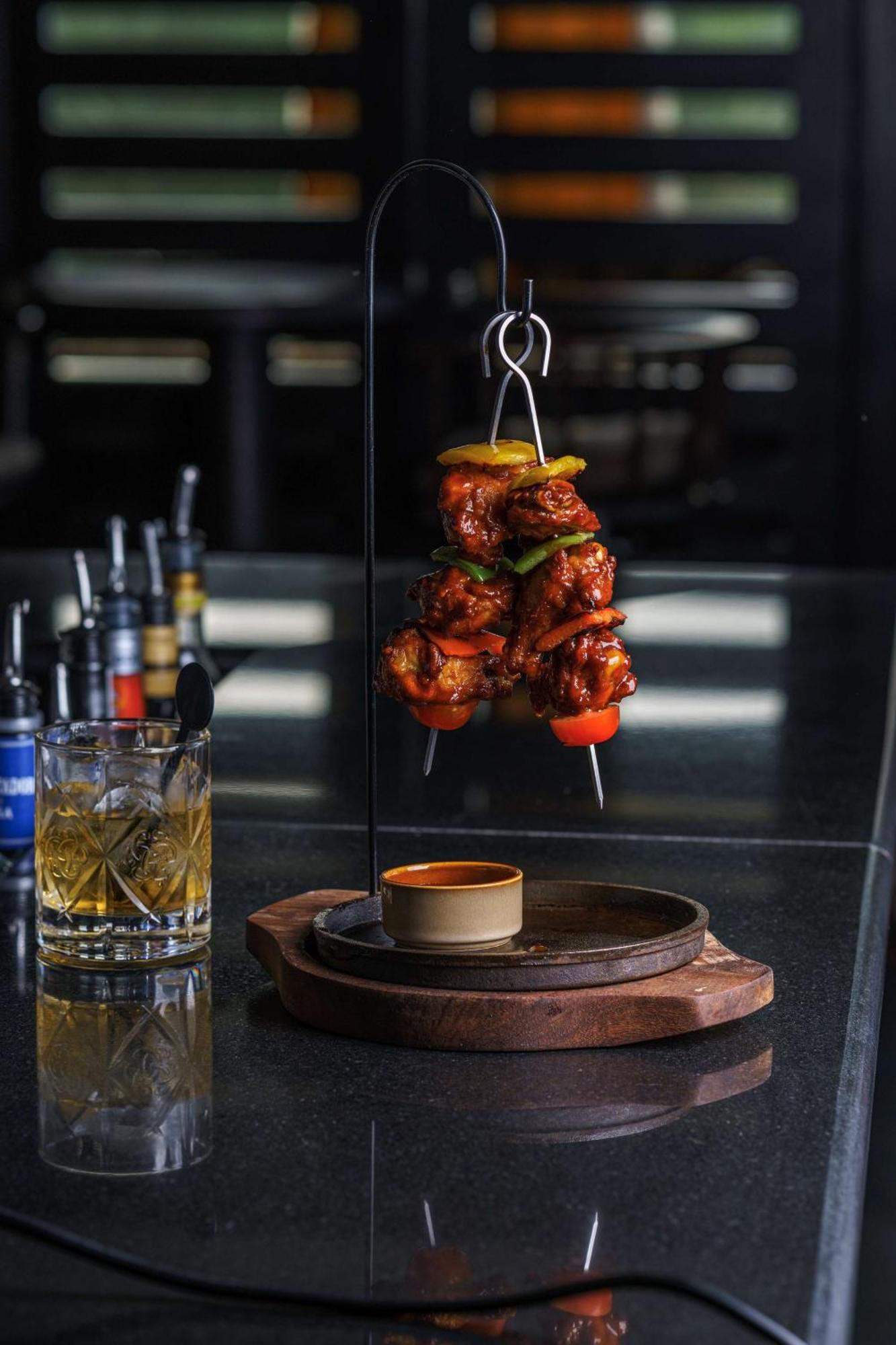 Radisson Blu Hotel & Resort, Сухар Экстерьер фото A chicken tikka served on a skewer